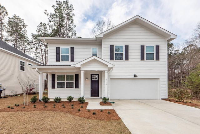 traditional-style house featuring covered porch, driveway, and an attached garage