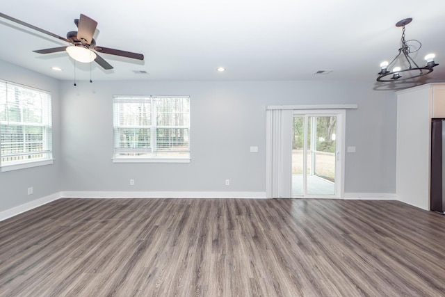 empty room featuring visible vents, recessed lighting, baseboards, and wood finished floors