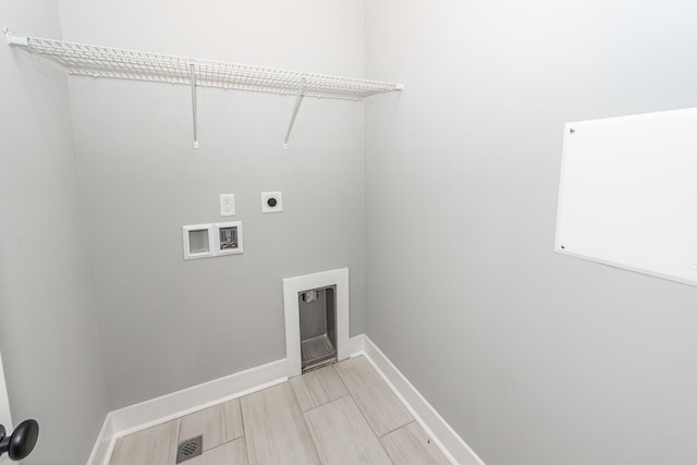 laundry room featuring visible vents, baseboards, washer hookup, laundry area, and electric dryer hookup