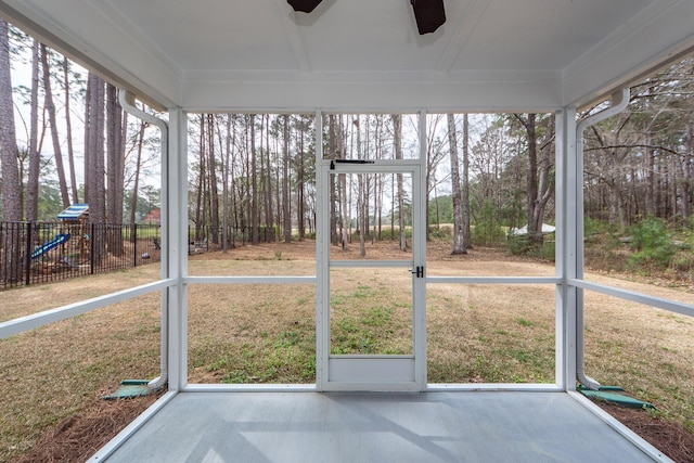 unfurnished sunroom with a healthy amount of sunlight and ceiling fan