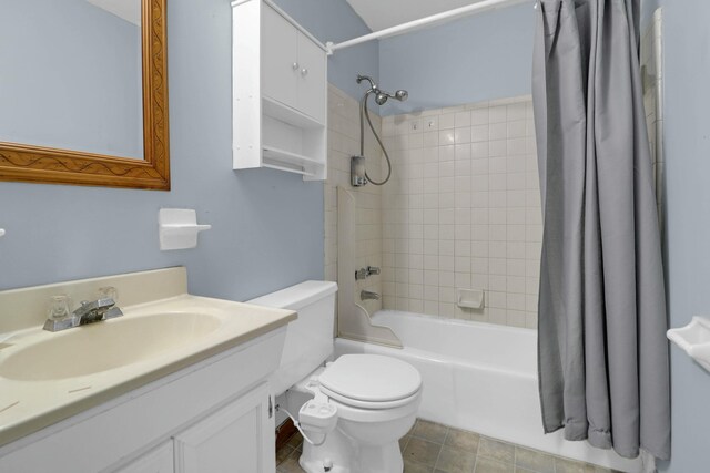 full bathroom featuring toilet, shower / tub combo, and vanity