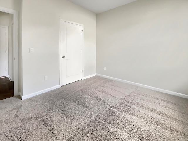 spare room featuring carpet