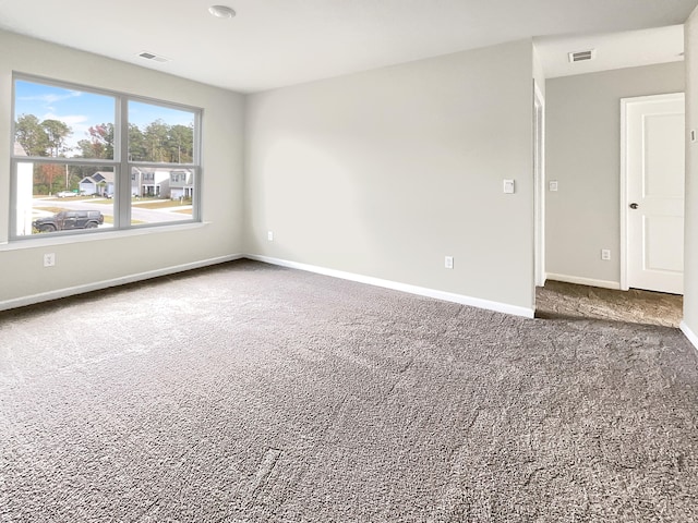 unfurnished room with carpet floors