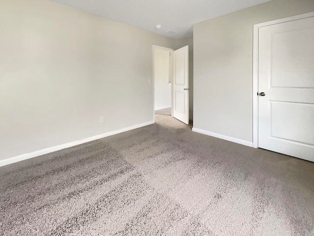 unfurnished room featuring carpet flooring