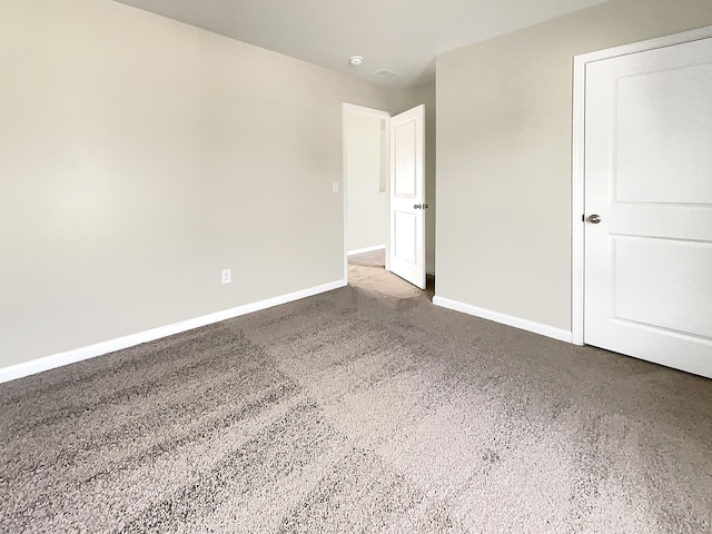 spare room with carpet floors