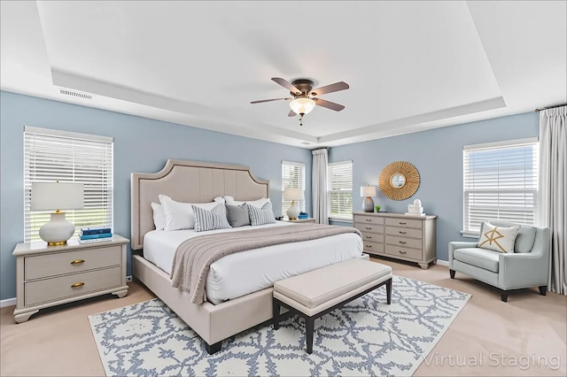 158 Netherfield Dr, Summerville, SC 29486 - bedroom featuring a tray ceiling, a ceiling fan, and light carpet