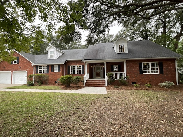 cape cod-style house featuring a front yard and a porch