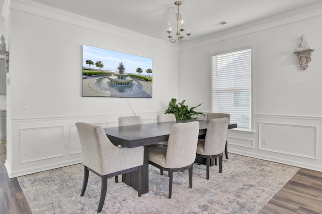 dining room featuring ornamental molding, an inviting chandelier, and a wealth of natural light