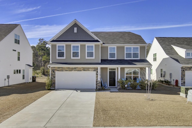 view of front of property featuring a garage and a porch