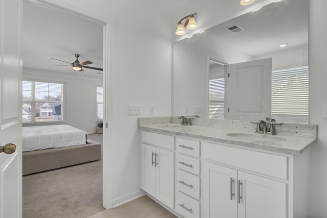 bathroom with ceiling fan, tile patterned floors, and vanity