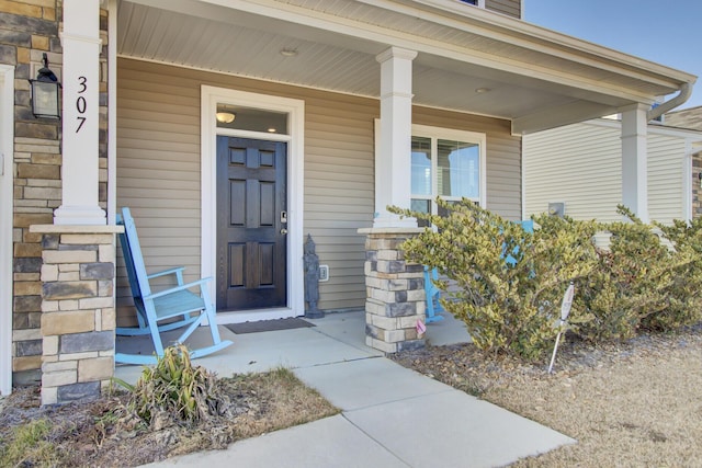 doorway to property with a porch