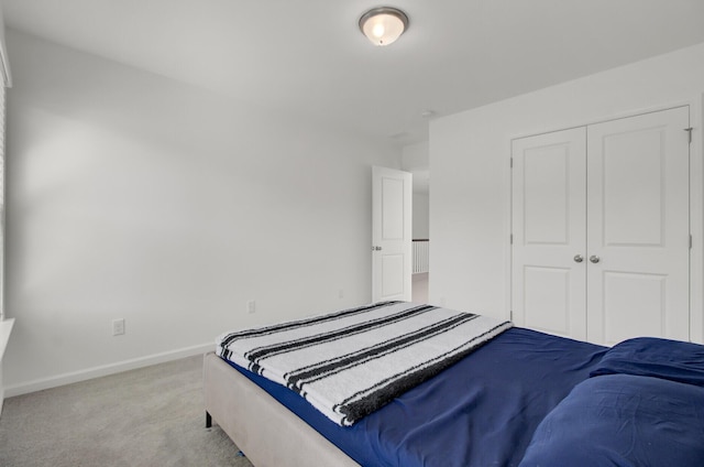 carpeted bedroom featuring a closet