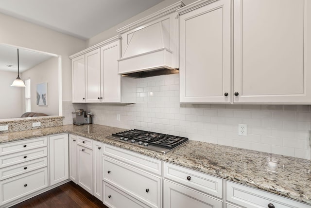 1870 Gammon St, Charleston, SC 29414 - kitchen featuring stainless steel gas stovetop, backsplash, light stone counters, and white cabinetry