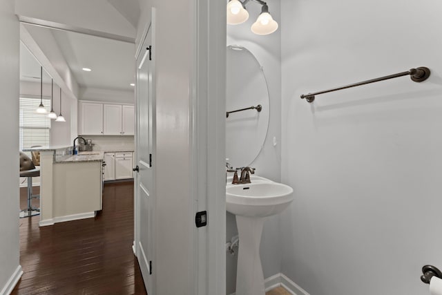 1870 Gammon St, Charleston, SC 29414 - bathroom with wood finished floors, baseboards, and a sink