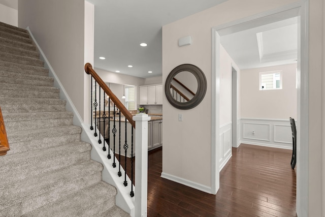 1870 Gammon St, Charleston, SC 29414 - stairway with wood finished floors, recessed lighting, and wainscoting