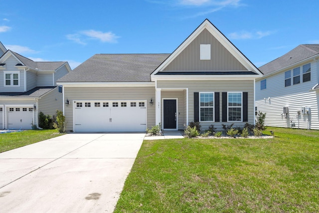 341 Witch Hazel St, Summerville, SC 29486 - craftsman inspired home featuring board and batten siding, a front yard, a garage, and concrete driveway