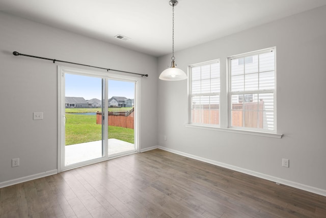 341 Witch Hazel St, Summerville, SC 29486 - empty room featuring dark wood-style floors, baseboards, and a water view