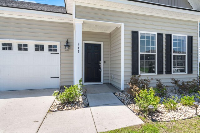 341 Witch Hazel St, Summerville, SC 29486 - doorway to property featuring a garage and driveway