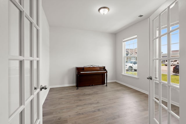 341 Witch Hazel St, Summerville, SC 29486 - bedroom featuring french doors, light wood-style floors, and baseboards