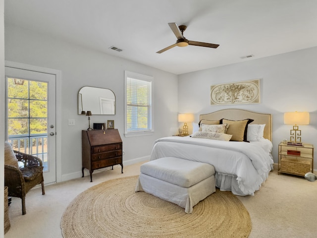 bedroom featuring access to outside, light colored carpet, visible vents, and baseboards