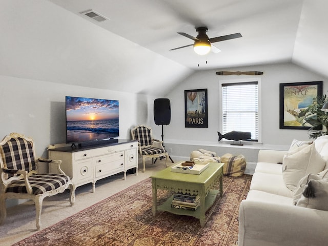 living area featuring carpet floors, lofted ceiling, visible vents, and ceiling fan