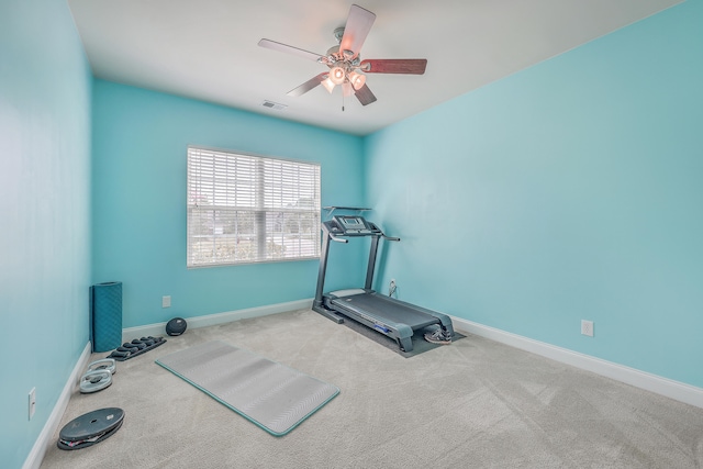 workout room with carpet flooring and ceiling fan