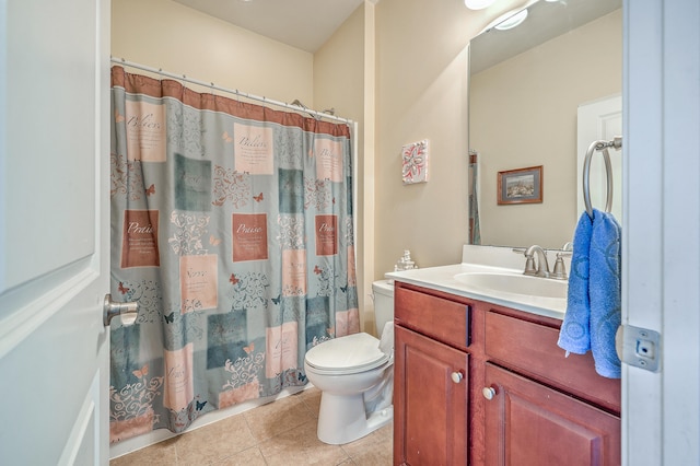 bathroom with a shower with shower curtain, tile patterned flooring, vanity, and toilet