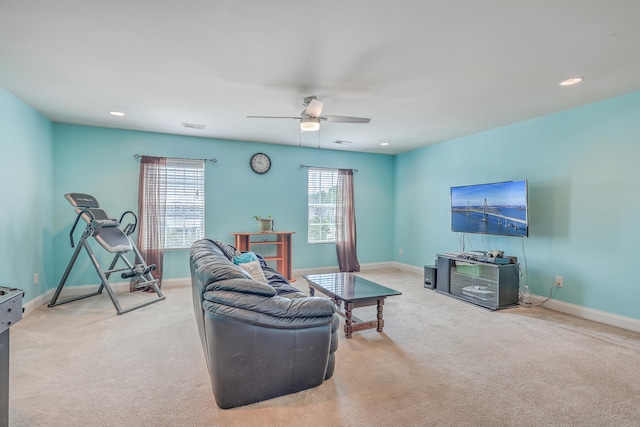 carpeted living room featuring ceiling fan