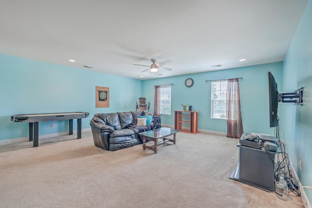 living room with ceiling fan and light carpet