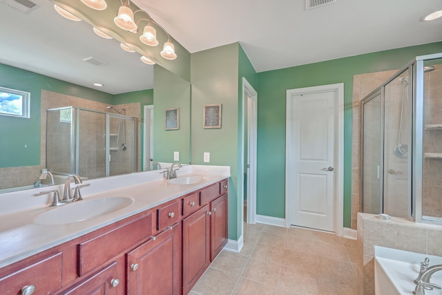 bathroom with tile patterned floors, independent shower and bath, and vanity