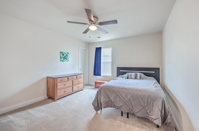 bedroom featuring ceiling fan and light colored carpet