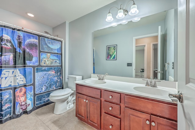 bathroom with tile patterned flooring, a shower with curtain, vanity, and toilet