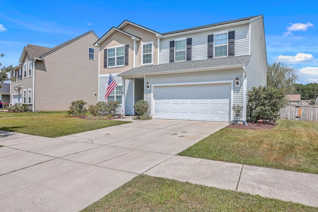 view of front of home featuring a garage and a front lawn