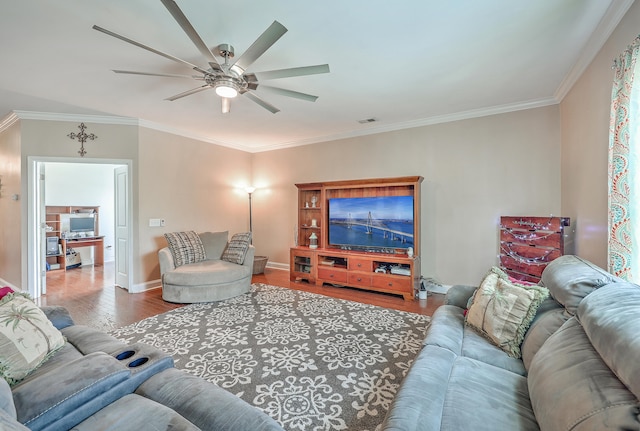 living room with ceiling fan, crown molding, and hardwood / wood-style floors