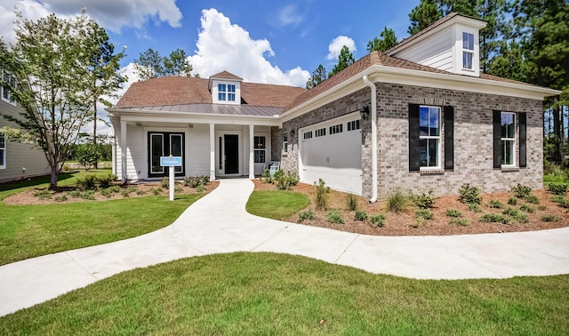113 Magnolia House Dr, Summerville, SC 29486 - view of front of property with a front yard, a garage, a standing seam roof, a porch, and metal roof