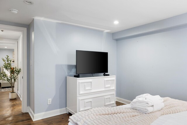 bedroom with hardwood / wood-style floors