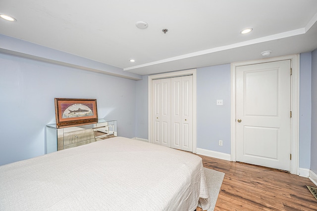 bedroom featuring a closet and hardwood / wood-style floors