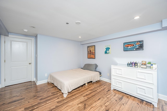 bedroom featuring hardwood / wood-style floors