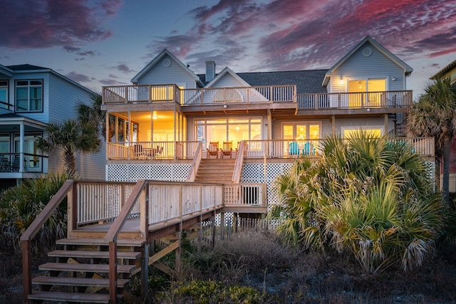 505 E Arctic Ave, Folly Beach, SC 29439 - rear view of property featuring stairs, a balcony, a chimney, and a wooden deck