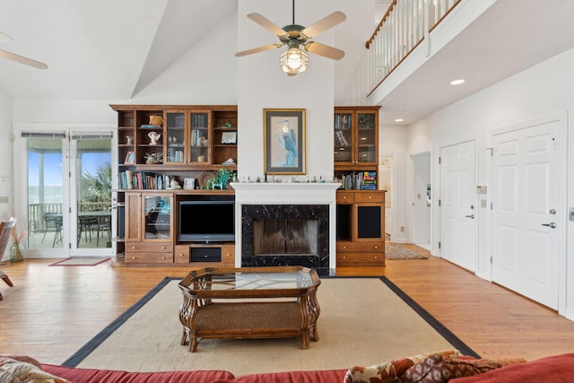 505 E Arctic Ave, Folly Beach, SC 29439 - living room with a ceiling fan, high vaulted ceiling, wood finished floors, and a premium fireplace
