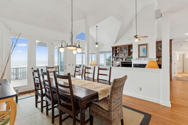 505 E Arctic Ave, Folly Beach, SC 29439 - dining space with a ceiling fan, high vaulted ceiling, and wood finished floors