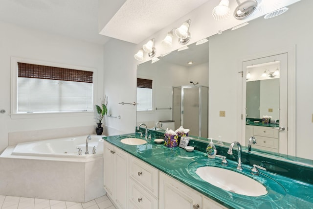 505 E Arctic Ave, Folly Beach, SC 29439 - full bath featuring a stall shower, a jetted tub, double vanity, and tile patterned flooring