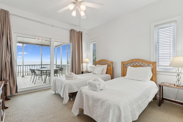 505 E Arctic Ave, Folly Beach, SC 29439 - bedroom featuring access to exterior, carpet flooring, a water view, and a ceiling fan