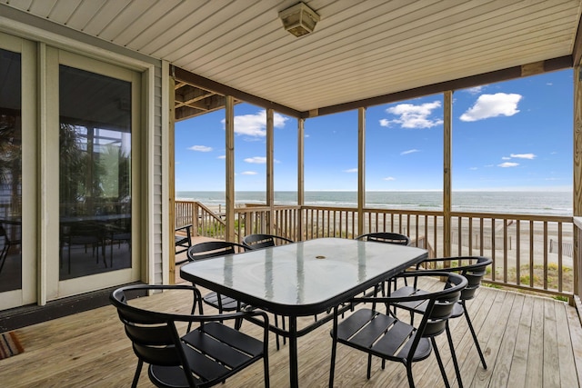 505 E Arctic Ave, Folly Beach, SC 29439 - sunroom featuring outdoor dining area, plenty of natural light, hardwood / wood-style floors, and a deck with water view