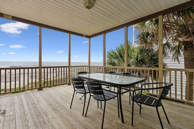 505 E Arctic Ave, Folly Beach, SC 29439 - sunroom with wood finished floors, outdoor dining space, and a deck with water view