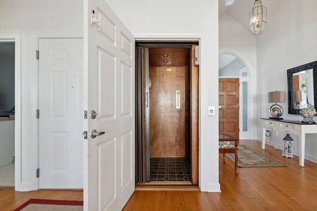 505 E Arctic Ave, Folly Beach, SC 29439 - hallway with wood finished floors and elevator