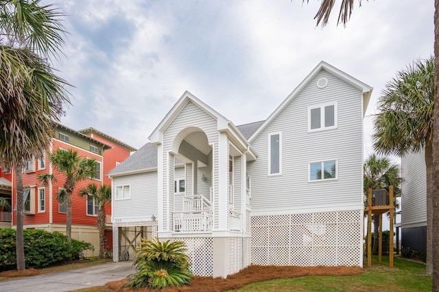 505 E Arctic Ave, Folly Beach, SC 29439 - view of front facade featuring driveway and a shingled roof