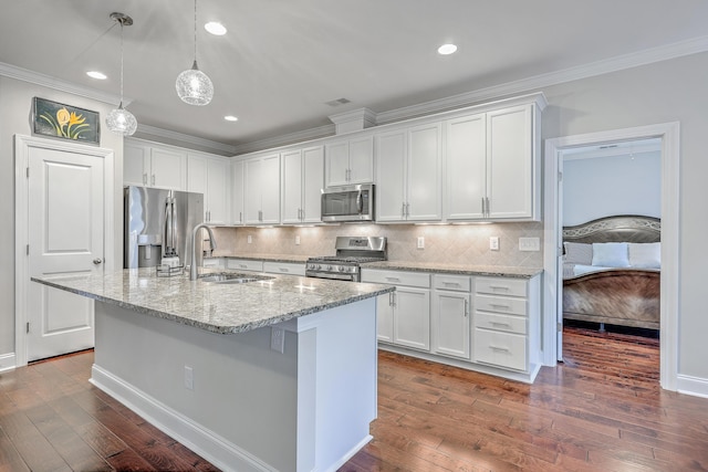 kitchen with white cabinetry, sink, pendant lighting, and appliances with stainless steel finishes