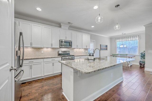 kitchen with appliances with stainless steel finishes, sink, and white cabinets