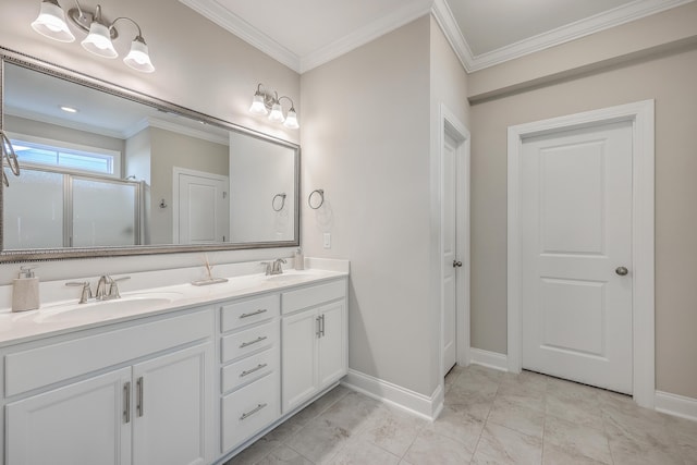 bathroom with crown molding, vanity, and an enclosed shower